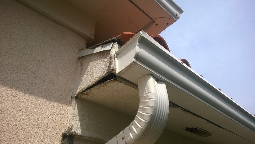 Signs of damage where water has been seeping through the ruined underlayment.