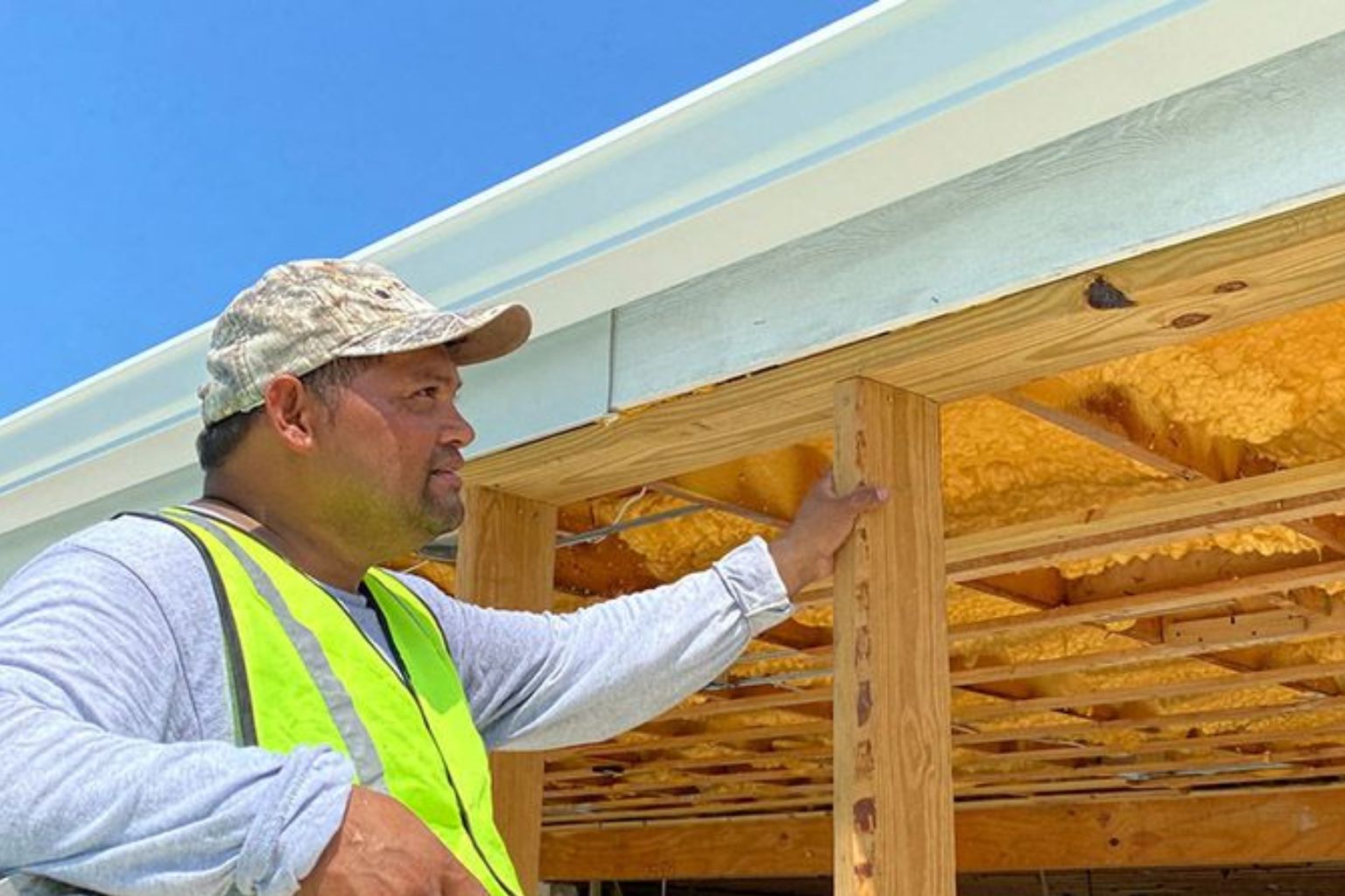 Gutters being installed in new home