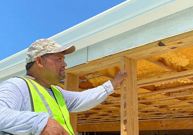 Gutters being installed in new home